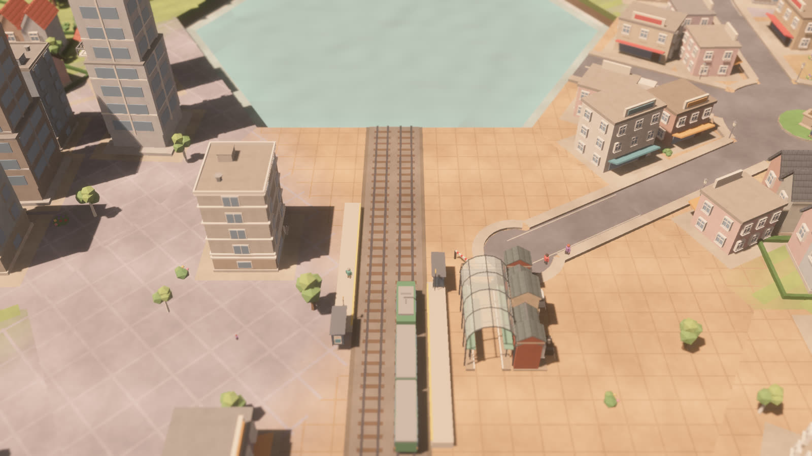 A train pulling into a glass-roofed station between apartment blocks